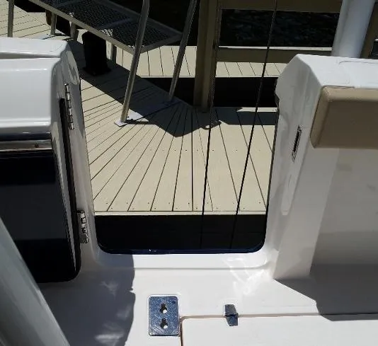 Slide: The Image of 2017 Pursuit S 408 Sport boat docked at a wooden pier. - 39