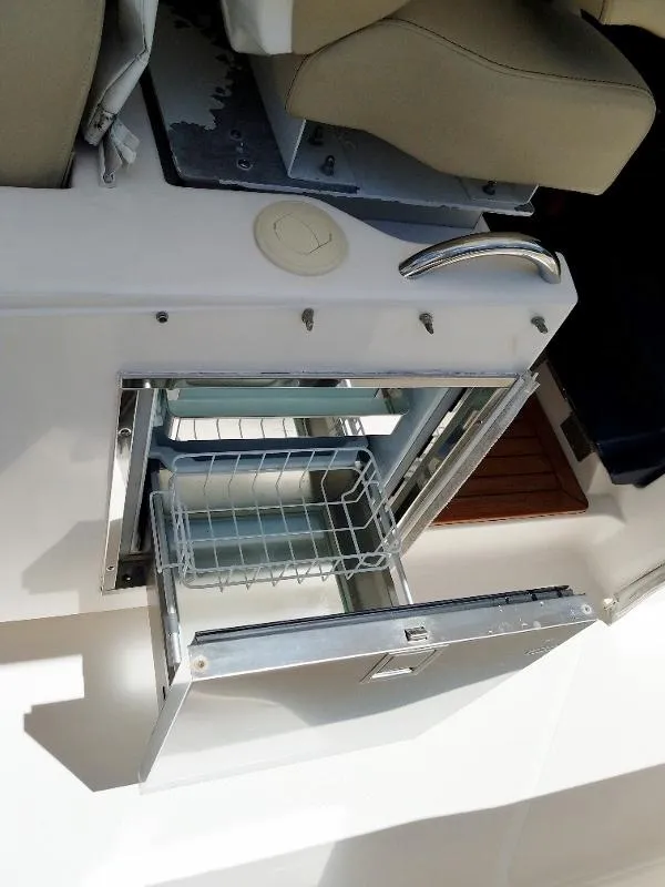 Slide: The Image of 2017 Pursuit S 408 Sport boat with open stainless steel drawer. - 40