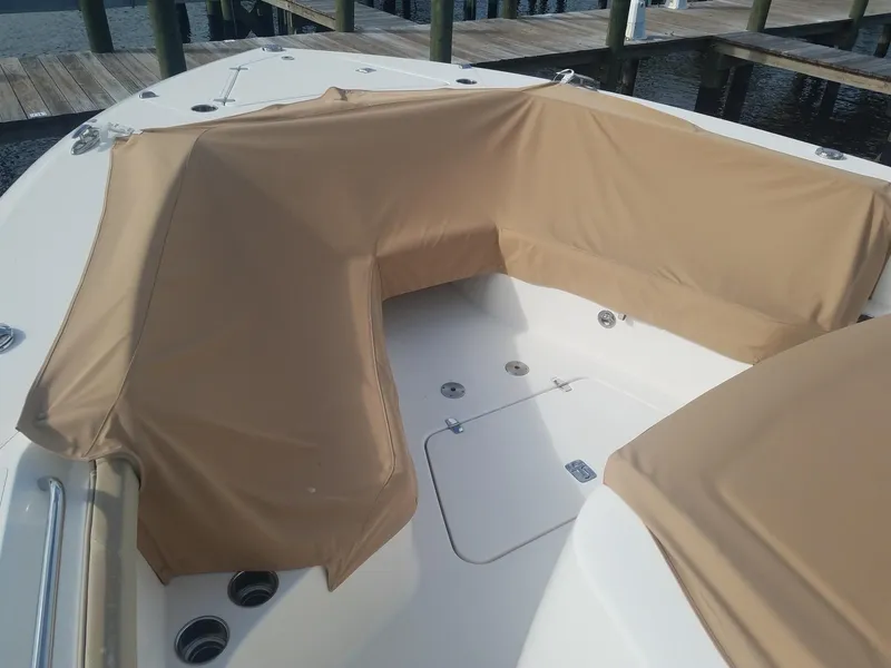 Slide: The Image of 2017 Pursuit S 408 Sport boat with tan protective covers on deck. - 45