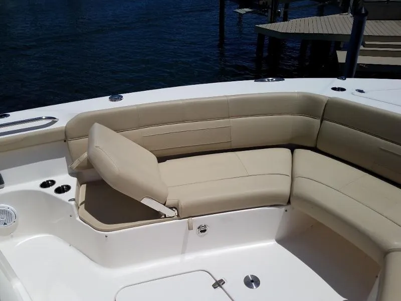 Slide: The Image of 2017 Pursuit S 408 Sport boat with beige cushioned seating. - 49