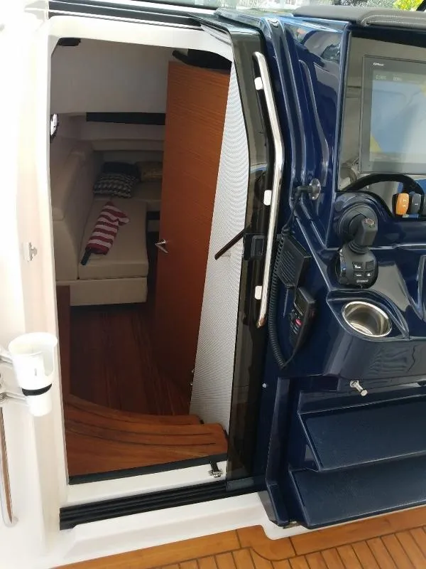 Slide: The Image of 2017 Pursuit S 408 Sport cabin entrance with interior view. - 58