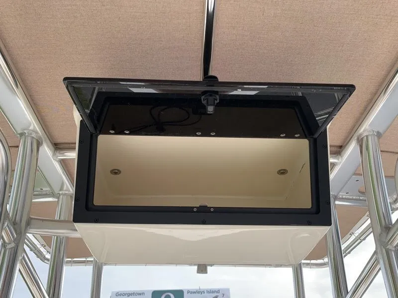 Slide: The Image of Pioneer Islander 180 boat console storage, 2025 model, open compartment view. - 11