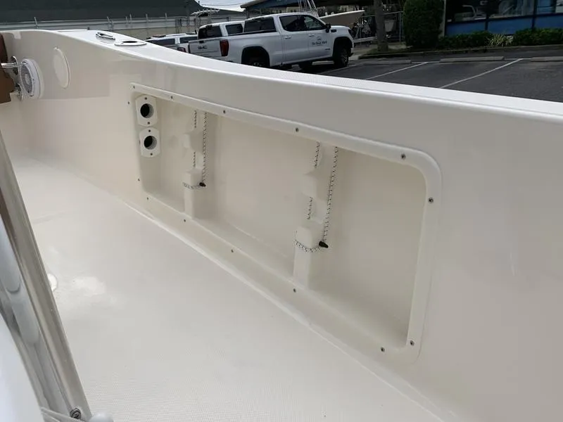 Slide: The Image of 2025 Pioneer Islander 180 boat interior with storage compartment and clean design. - 16