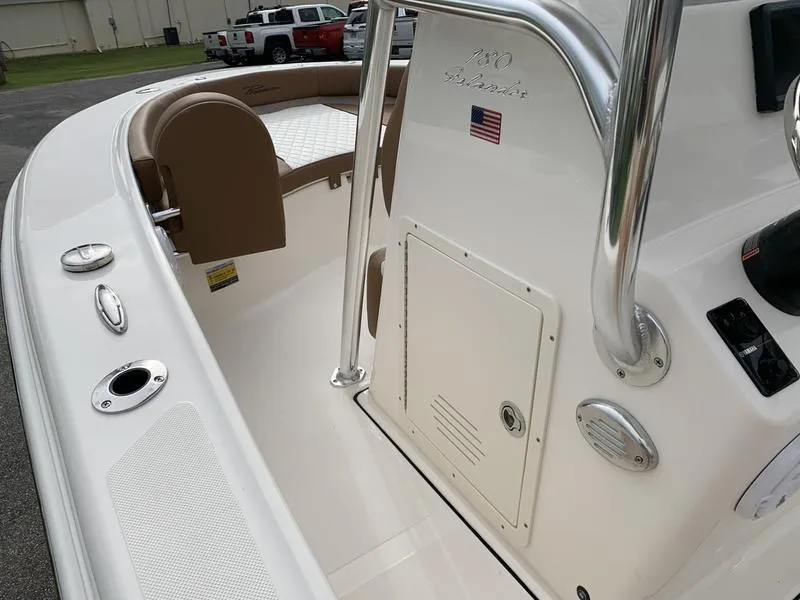 Slide: The Image of 2025 Pioneer Islander 180 boat interior with seating and storage compartment. - 22
