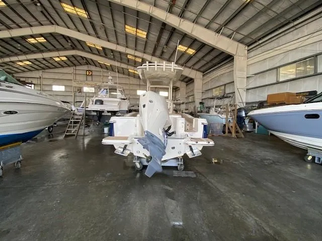 Slide: The Image of 2025 Scout 215 XSF boat in a large indoor storage facility. - 4