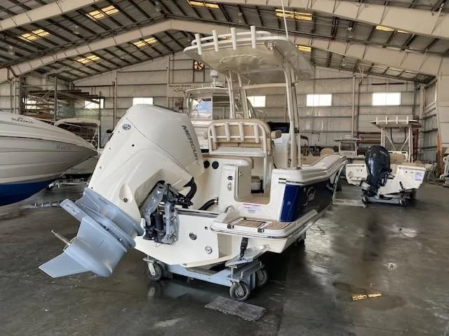 Slide: The Image of 2025 Scout 215 XSF boat in a storage facility, rear view. - 5