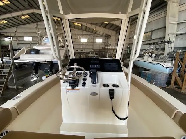 Slide: The Image of 2025 Scout 215 XSF boat console in a warehouse. - 6