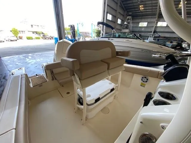 Slide: The Image of 2025 Scout 215 XSF boat interior with seating and storage. - 9