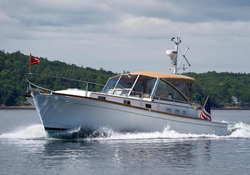 Slide: The Image of 2000 Grand Banks Eastbay 43 Ex cruising on open water. - 10