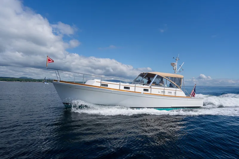 Slide: The Image of 2000 Grand Banks Eastbay 43 Ex cruising on open water. - 15