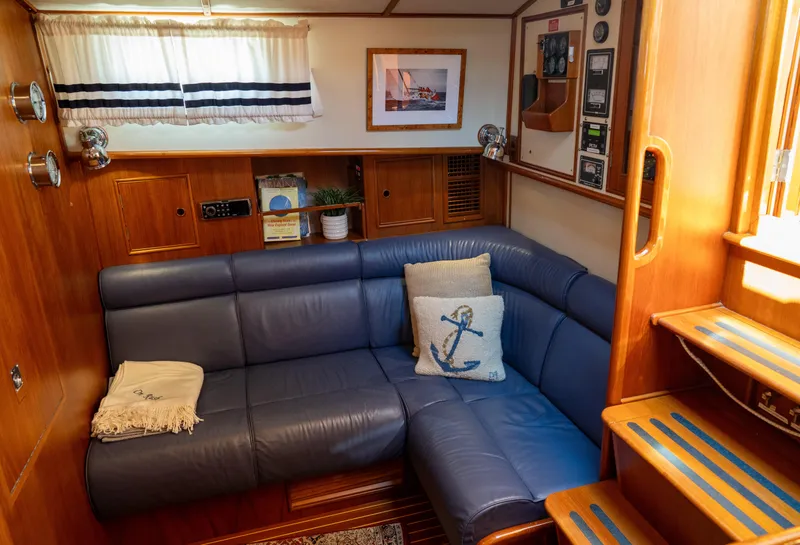 Slide: The Image of 2000 Grand Banks Eastbay 43 Ex galley with wood cabinetry, sink, and stove. - 50