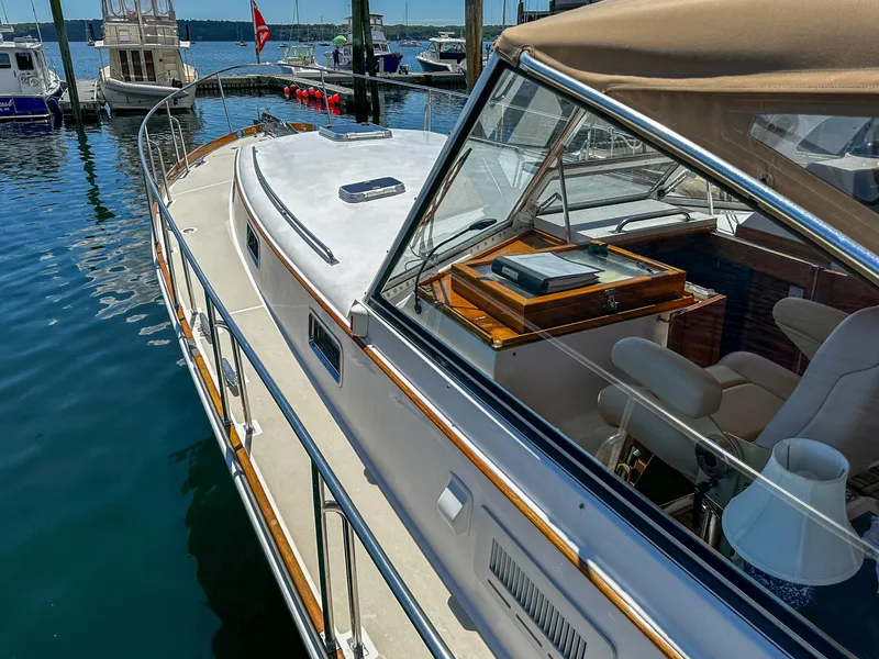 Slide: The Image of 2000 Grand Banks Eastbay 43 Ex yacht deck with stainless steel railings at marina. - 26