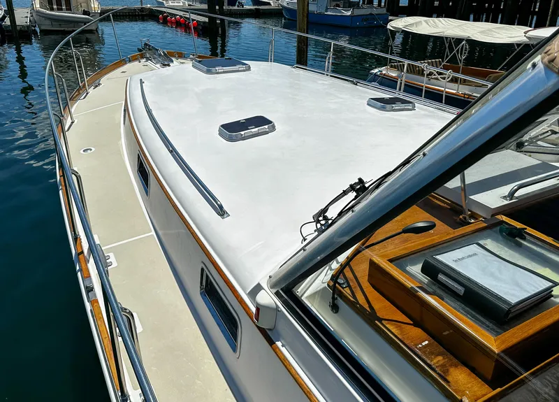 Slide: The Image of 2000 Grand Banks Eastbay 43 Ex yacht docked at marina, side view. - 27