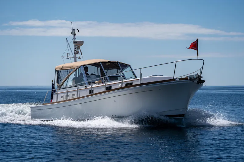 Slide: The Image of 2000 Grand Banks Eastbay 43 Ex cruising on open water. - 13