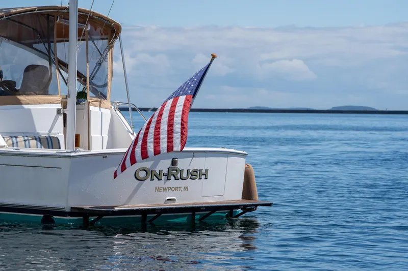 Slide: The Image of Grand Banks Eastbay 43 Ex 2000 yacht On-Rush in Newport, RI, with American flag. - 19