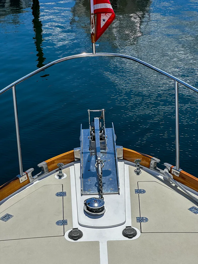 Slide: The Image of Bow of 2000 Grand Banks Eastbay 43 Ex yacht with anchor and American flag. - 21