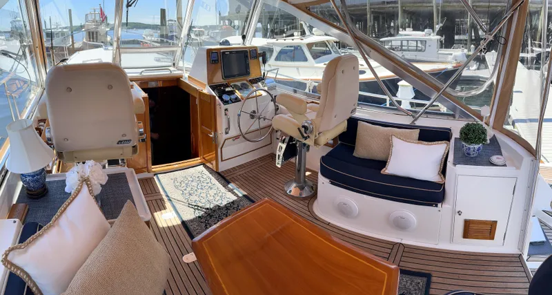 Slide: The Image of Interior of 2000 Grand Banks Eastbay 43 Ex yacht with helm and seating area. - 34