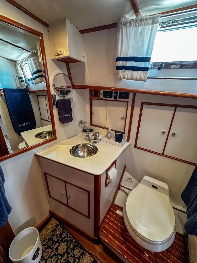 Slide: The Image of Bathroom interior of 2000 Grand Banks Eastbay 43 Ex yacht with sink, toilet, and mirror. - 38
