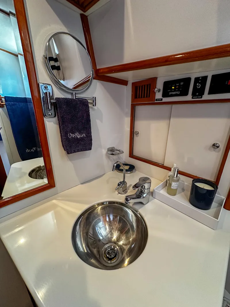Slide: The Image of 2000 Grand Banks Eastbay 43 Ex bathroom sink and vanity area - 39