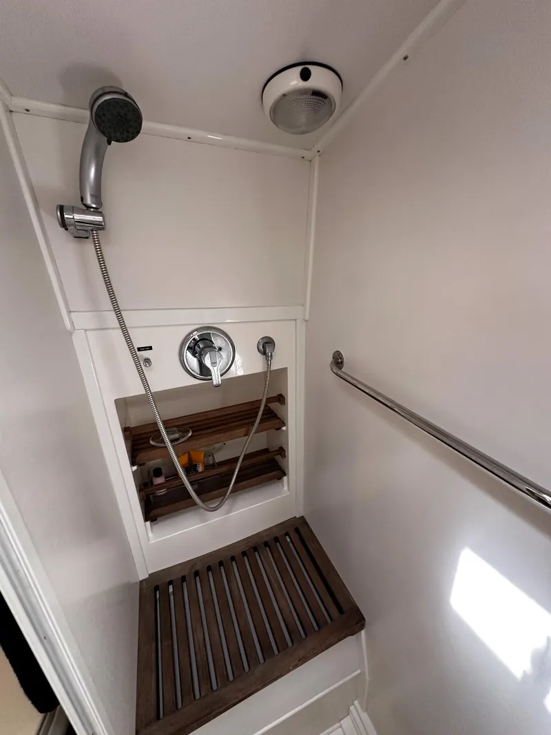 Slide: The Image of Shower area in 2000 Grand Banks Eastbay 43 Ex yacht with wooden floor grate. - 40