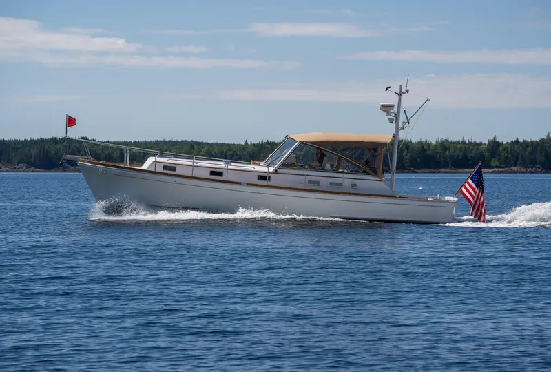 Slide: The Image of 2000 Grand Banks Eastbay 43 Ex cruising on open water. - 9