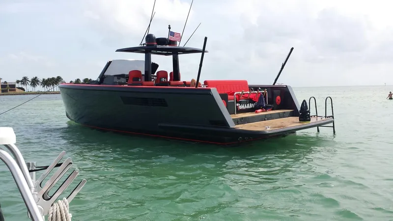 Slide: The Image of 2008 Fjord Express boat on calm water, featuring sleek design and vibrant red accents. - 1