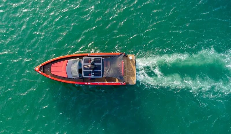 Slide: The Image of Aerial view of 2008 Fjord Express boat cruising on turquoise water. - 14
