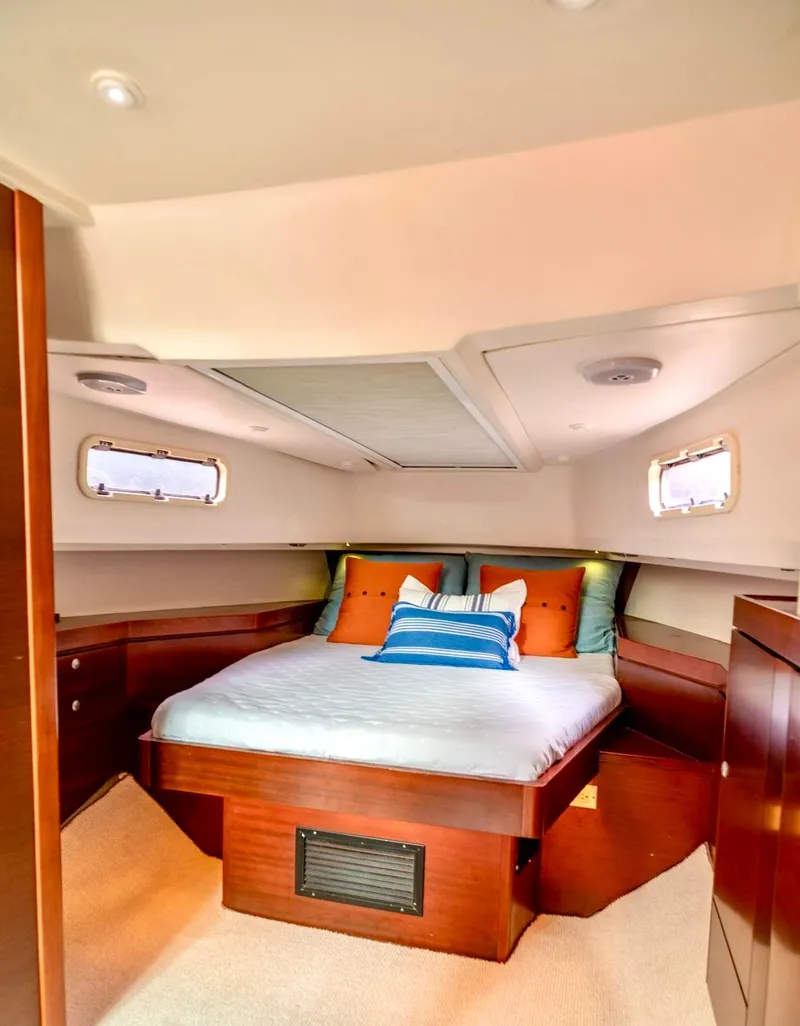 Slide: The Image of 2008 Fjord Express cabin interior with cozy bed and wooden furnishings. - 16