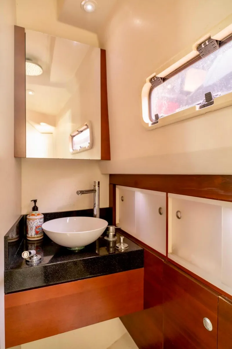 Slide: The Image of Luxurious bathroom in 2008 Fjord Express yacht with modern sink and wooden cabinetry. - 17