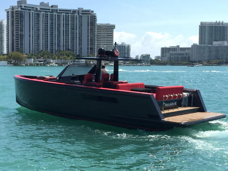 Slide: The Image of 2008 Fjord Express boat cruising in sunny waters near urban skyline. - 2