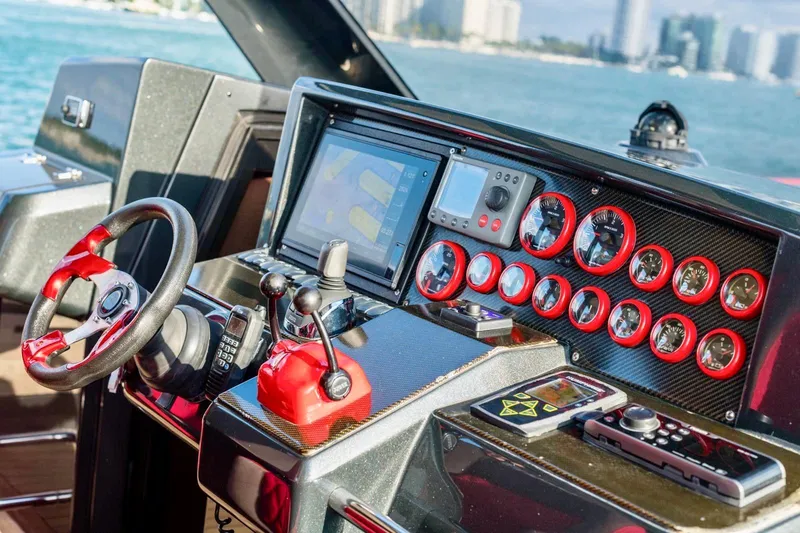 Slide: The Image of Dashboard of a 2008 Fjord Express boat with modern controls and navigation system. - 26