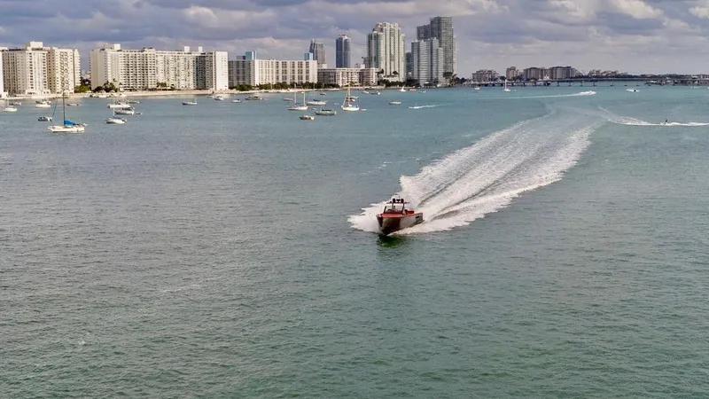 Slide: The Image of Speedboat cruising in coastal waters with city skyline in the background, Fjord Express 2008. - 29