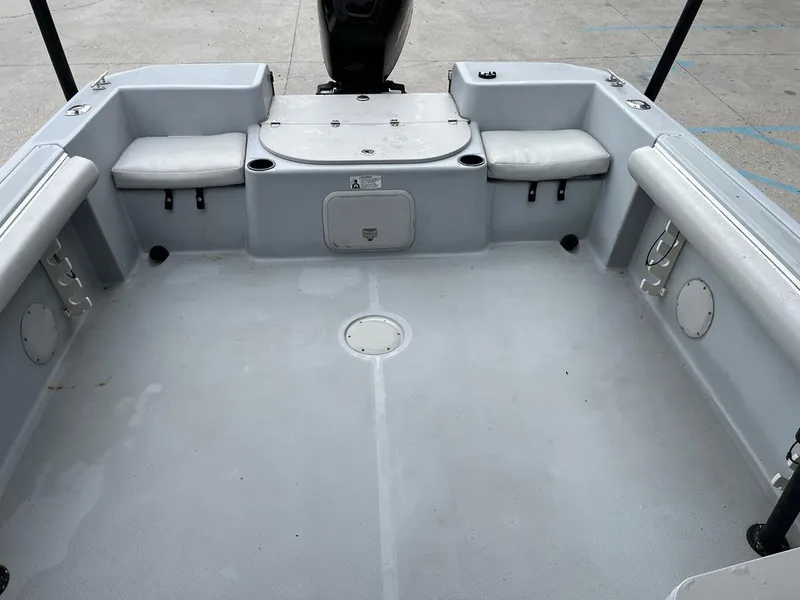 Slide: The Image of 2004 Pro-Line 2200 Dual Console boat interior with seating and storage compartments. - 12