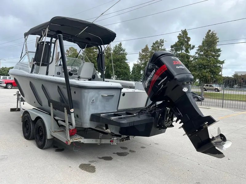 Slide: The Image of 2004 Pro-Line 2200 Dual Console boat with Mercury outboard motor on trailer. - 4