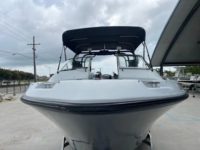 Slide: The Image of 2004 Pro-Line 2200 Duel Console boat with black canopy, front view. - 7