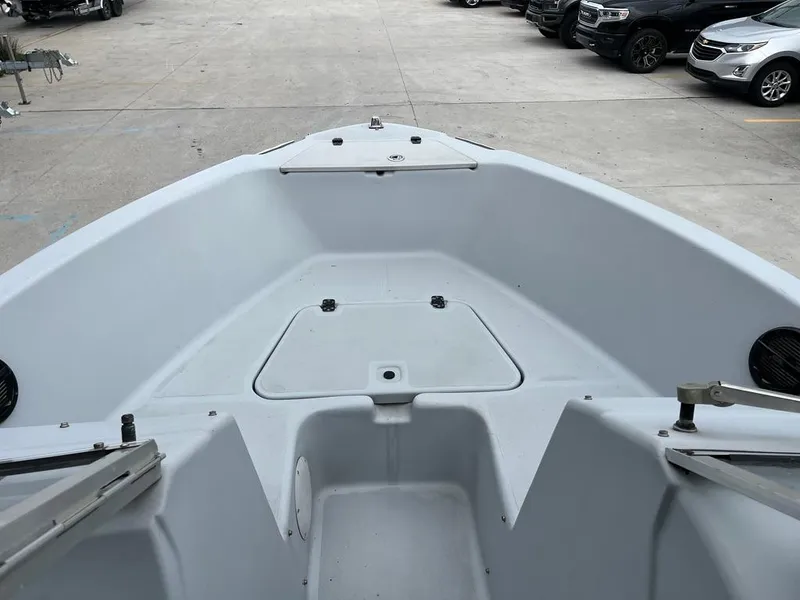 Slide: The Image of 2004 Pro-Line 2200 Dual Console boat bow area with storage compartment. - 8