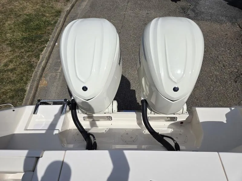 Slide: The Image of 2024 Grady-White Freedom 307 twin outboard engines, rear view. - 4
