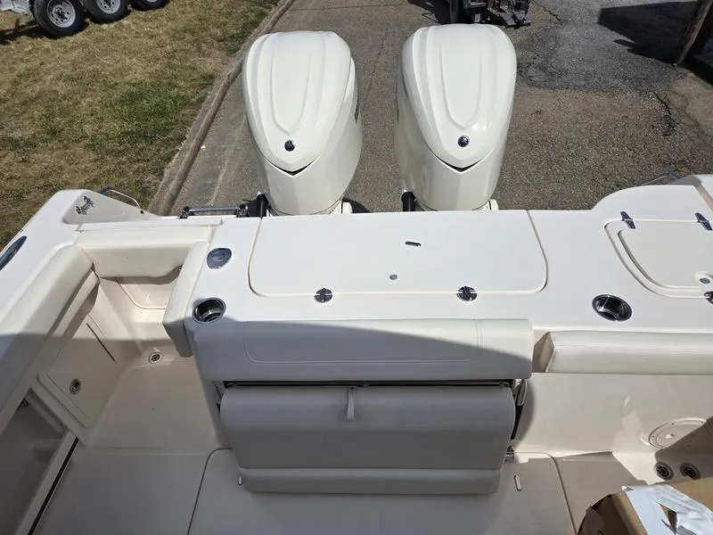 Slide: The Image of 2024 Grady-White Freedom 307 boat with dual outboard engines. - 5