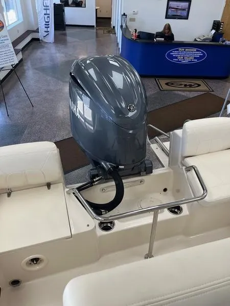 Slide: The Image of 2025 Grady-White Fisherman 180 boat with Yamaha outboard motor in showroom. - 10