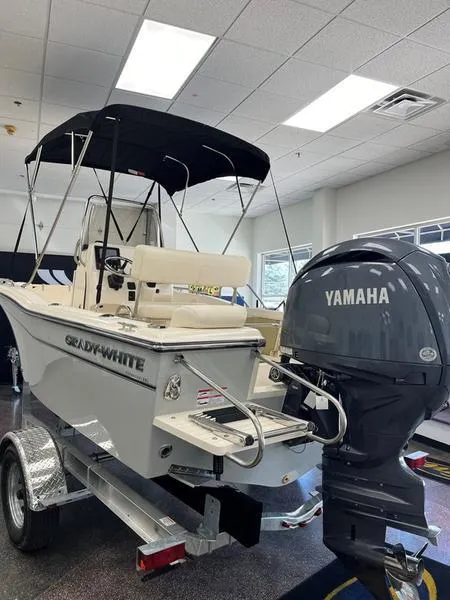 Slide: The Image of 2025 Grady-White Fisherman 180 boat with Yamaha engine in showroom. - 2