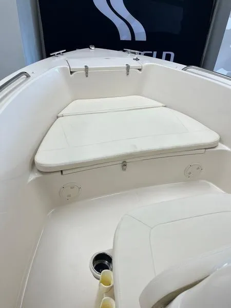 Slide: The Image of 2025 Grady-White Fisherman 180 boat interior with cushioned seating and storage. - 5
