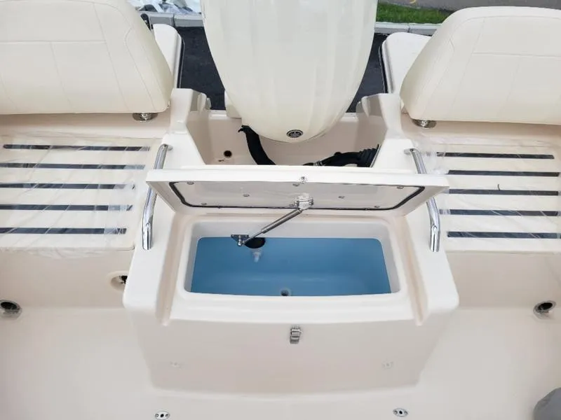 Slide: The Image of 2025 Grady-White Freedom 215 boat interior with open storage compartment. - 10