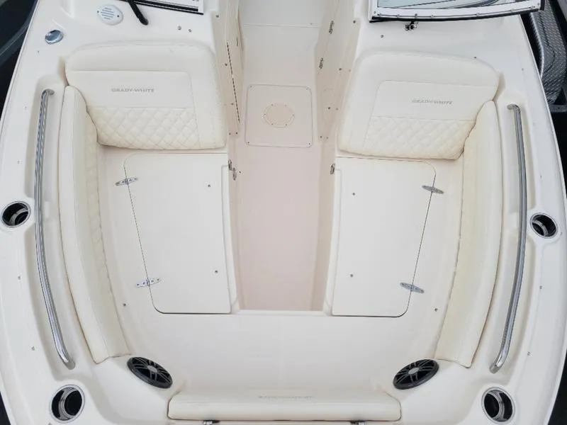 Slide: The Image of 2025 Grady-White Freedom 215 boat interior with cushioned seating and storage compartments. - 17