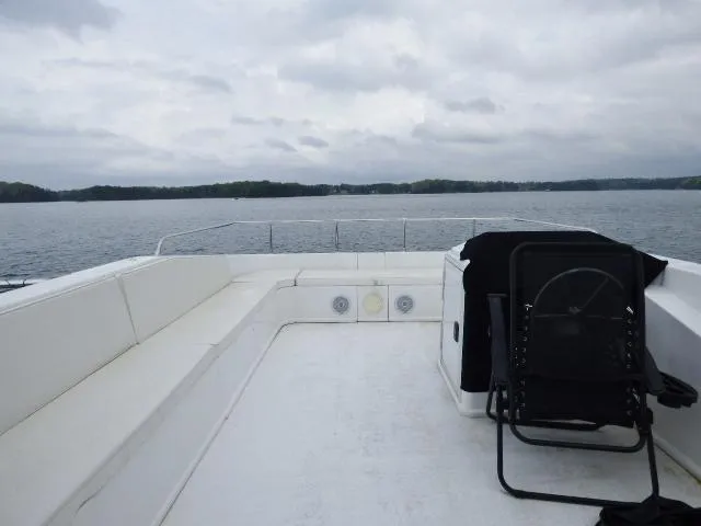 Slide: The Image of Top deck of 2023 Sumerset 18x90 houseboat with lake view. - 14