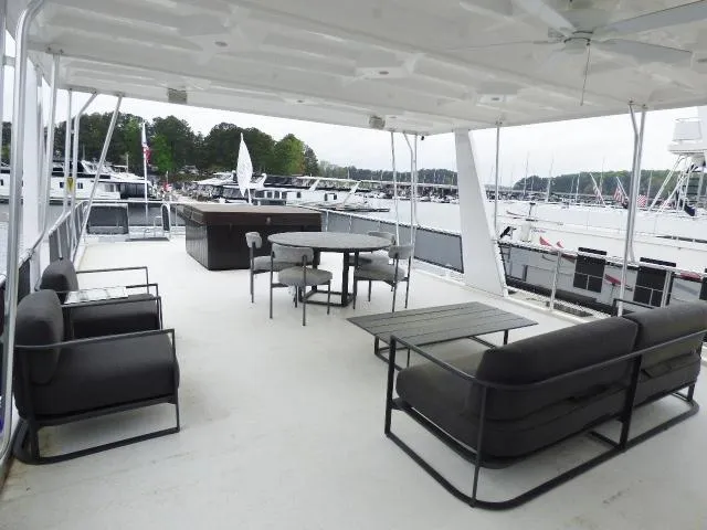 Slide: The Image of Spacious deck of 2023 Sumerset 18x90 houseboat with modern outdoor furniture. - 15
