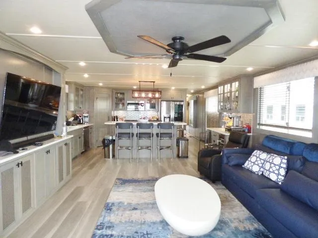 Slide: The Image of Modern interior of 2023 Sumerset 18x90 houseboat with open living area and kitchen. - 2