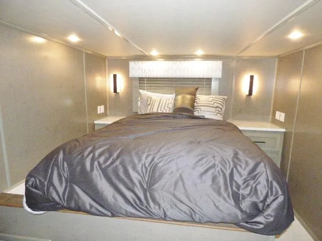 Slide: The Image of Modern bedroom in 2023 Sumerset 18x90 houseboat with cozy bedding and ambient lighting. - 6
