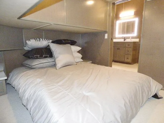 Slide: The Image of Sumerset 18x90 2023 model bedroom with modern decor and ensuite bathroom. - 9