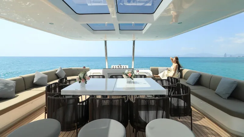 Slide: The Image of Luxurious 2024 Catamaran Diamond Yachts EF56 with spacious outdoor seating and ocean view. - 10