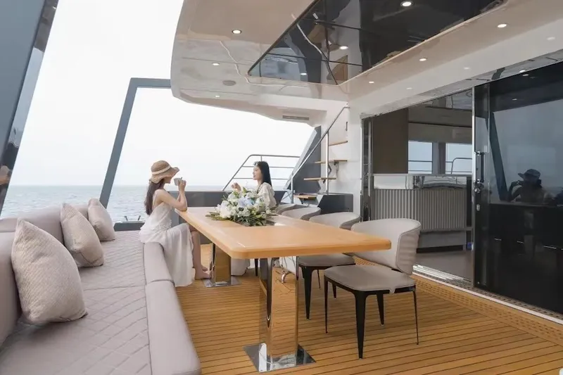 Slide: The Image of Luxurious deck of 2024 Catamaran Diamond Yachts EF56 with elegant seating and ocean view. - 16